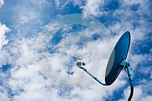 Network from satellite dish on blue sky background