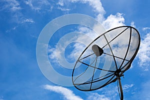 Network from satellite dish on blue sky background