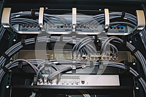 Network server rack with colored cables and ethernet switches in the data center