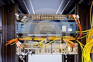 Network servers in a data center. Tier III carrier neutral data center. Server rooms.