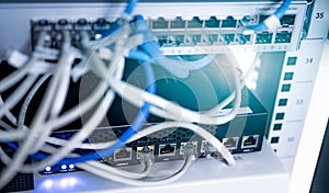 Network switch and ethernet cable in data center. Wifi plug of internet router for computer. Network hub. Communication networking