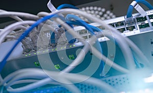 Network switch and ethernet cable in data center. Wifi plug of internet router for computer. Network hub. Communication networking
