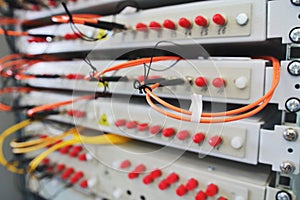 Network switch on rack with cables connected in data center room