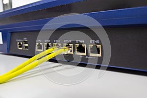 Network switch in rack, network cables connect SFP module port