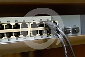 Network switch to create a single computer system and peripherals with an inserted cable