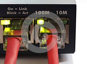 Network switch with two red ethernet cables