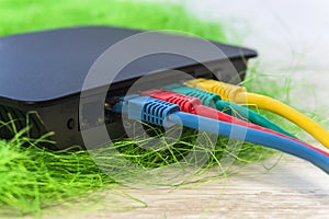 network switch with various color RJ45 cables connected for switching