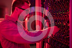 Network technician fixing supercomputer