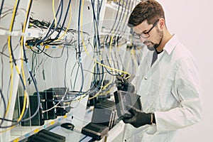 Network technician testing modems