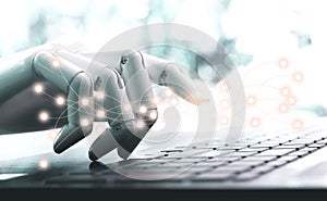 Network technology robot concept or robot hand chatbot pressing computer keyboard