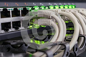 Network wires are included in the ports of the central router. Many Internet cables are  in the server room of the data center.