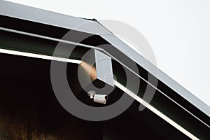 networkconnected camera positioned underneath eave to monitor urban area effectively during daytime