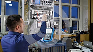 Networking service. network engineer administrator checking server hardware equipment of data center