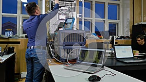 Networking service. network engineer administrator checking server hardware equipment of data center