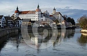 Neuburg an der Donau, Germany. Neuburg Castle, a residence of Dukes of Palatinate-Neuburg, reflected in Danube in sunny day. The