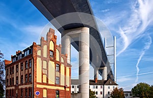 Neue RÃ¼genbrÃ¼cke - New Rugen Bridge over the Strelasund, connecting Stralsund and Rugia Island and buildings under the bridge