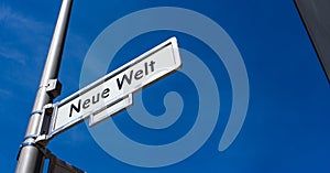 Neue Welt - new world - street sign in Berlin, Germany photo