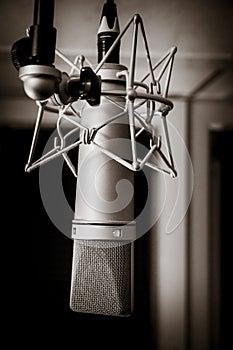 Neumann microphone in a professional audio studio. Black and white photography