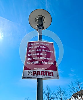 Neumuenster, Germany - 16. April 2022: An election poster of the German party named Die Partei on a lamppost before the state