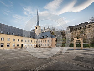Neumunster Abbey with St Michaels Church on background - Luxembourg City, Luxembourg