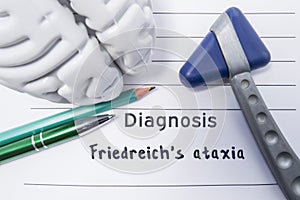 Neurological diagnosis of Friedreichs ataxia. Neurological hammer, shape of brain, pen and pencil the lying on medical report, lab photo