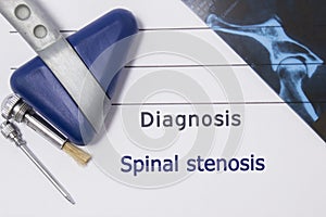 Neurological diagnosis of Spinal Stenosis. Neurologist directory, where is printed diagnosis Spinal Stenosis, lies on workplace wi