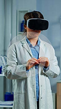Neurological scientist using medical inovation in lab wearing VR glasses