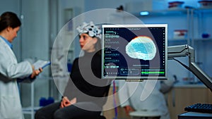 Neurologist doctor analysing nervous system using eeg headset