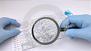 A neurologist examines an encephalogram of a patientâ€™s brain. Schedule of electroencephalograms