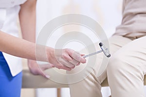 Neurologist making the medical examination photo