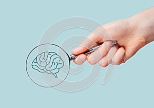 Neurology, brain health checkup, study through magnifying glass