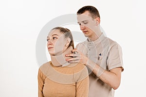 Neurosurgeon puts cervical soft collar or neck brace bandage on young woman to support and immobilize neck or for treat