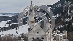 Neuschwanstein Castle on Rock in Winter Day. Bavarian Alps, Germany. Aerial View