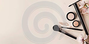 Neutral background with space for text alongside makeup products.