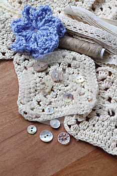 Neutral shades collection of craft items and blue flower