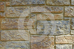 Neutral Stone Wall Background with Various Size Bricks