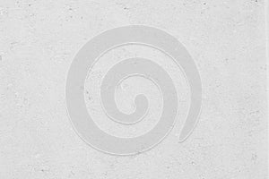 white colored low contrast Concrete textured background with roughness and irregularities photo