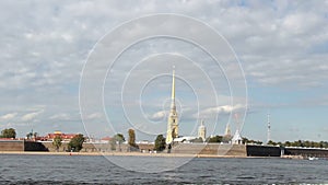 Neva river navigation, walk boats on the river, spire of Peter-Pavel`s Fortress in the Rabbit Island, summer excursion