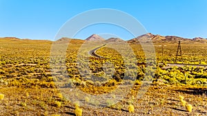 Nevada SR 6 winding through Nevada`s semi desert landscape. Looking east from the Saulsbury Wash Rest Area near Tonopah, Nevada