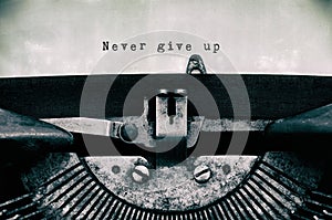 Never give up words typed on a vintage typewriter