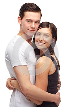 Never letting go. A cropped portrait of a happy and affectionate young couple isolated on white.