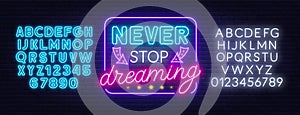 Never stop dreaming neon lettering on a dark background.
