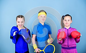 Never stop. workout of small girls boxer and boy in sportswear. Happy children in boxing gloves with tennis racket and