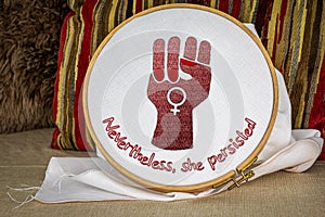Nevertheless she persisted with raised fist embroidery on hoop, craftivism feminist activism