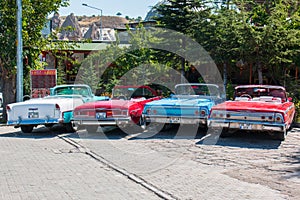 Old classic cars lined up side by siden