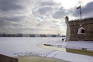 Nevskaya pier and the Commandant`s Gate in the Peter and Paul Fortress of St. Petersburg in winter