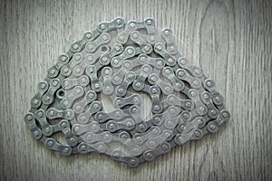 New 8-speed BBB mountain bike chain model BCH-80 on a wooden background