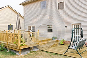 New above ground deck and patio of family home photo