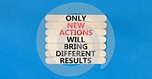New action symbol. Concept words Only new actions will bring different results on wooden sticks. Beautiful blue table blue