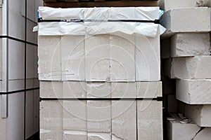 New aerated concrete blocks on pallets stored outdoors